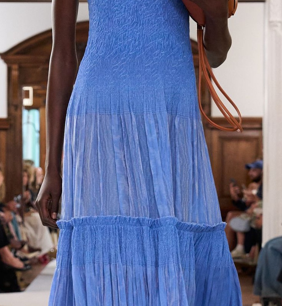 Close-up: blue cotton dress, smocked on the bodice and at the top of the lower tier, Ulla Johnson Spring 2026