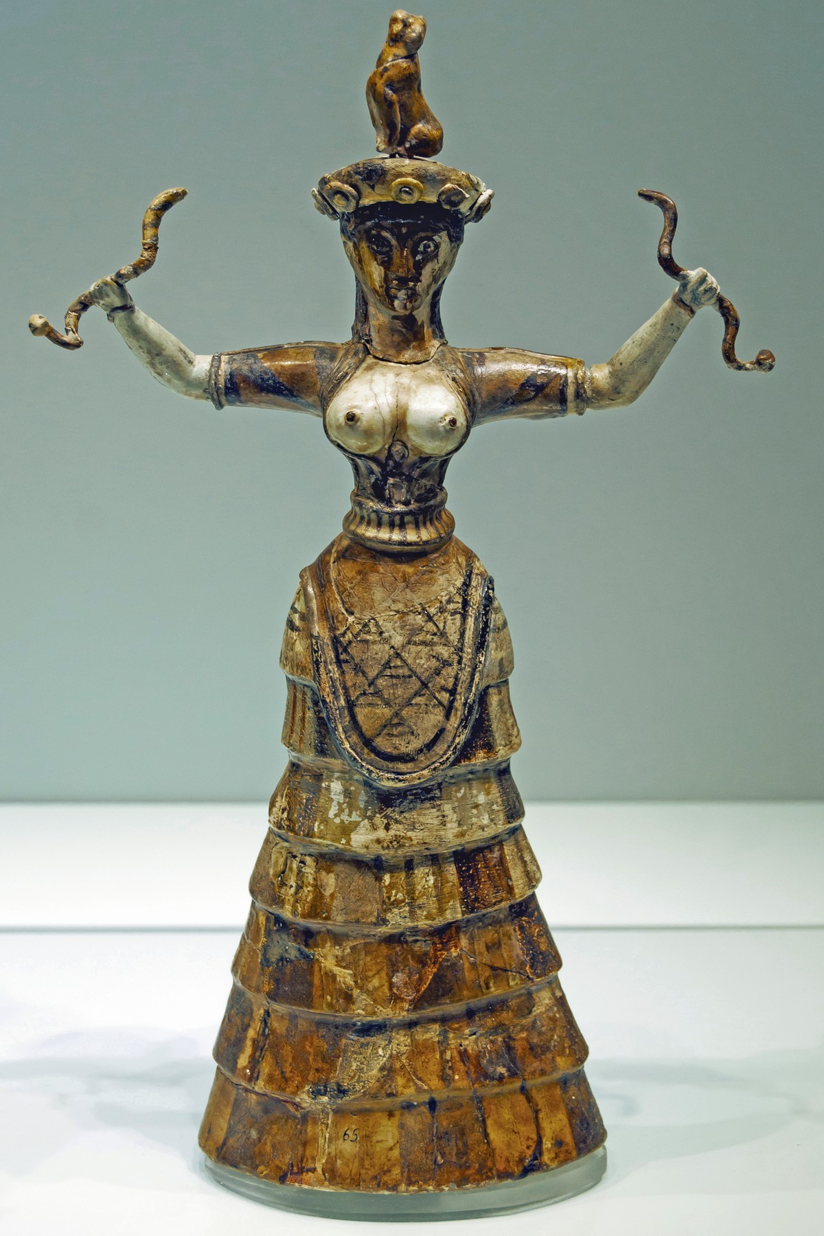 Minoan Snake Goddess figurine from Knossos, c. 1600 BC, in a bell-shaped skirt of overlapping flounces