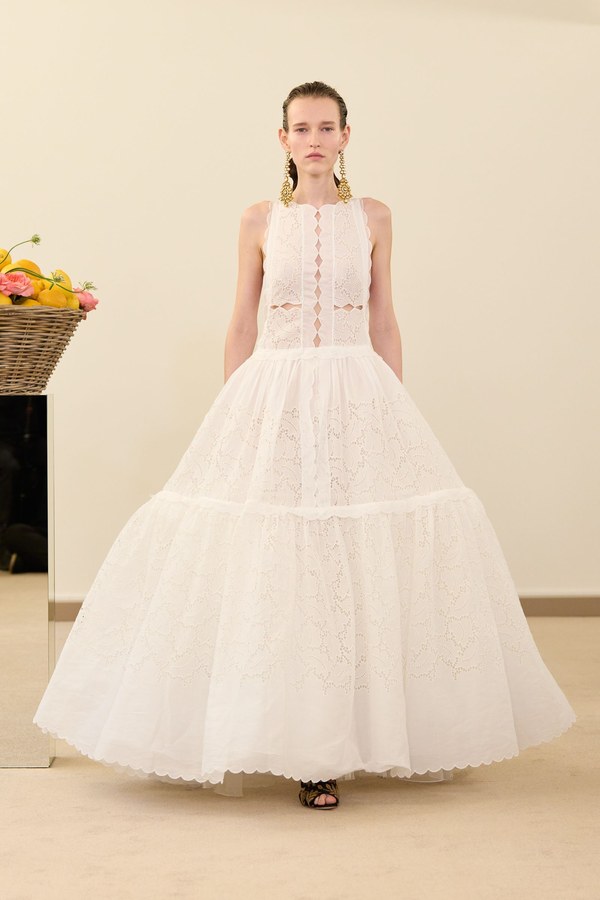 Giambattista Valli Spring 2026, look 4: white broderie anglaise dress with a full skirt of gathered tiers