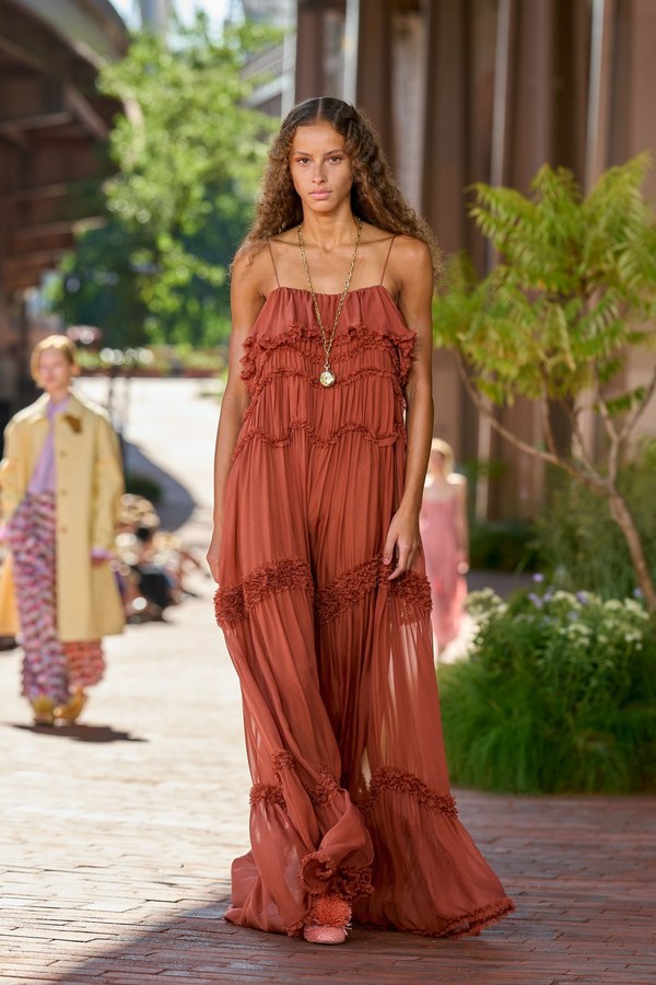 Ulla Johnson Spring 2027, look 26: rust tiered maxi dress with ruffled trim along the horizontal seams