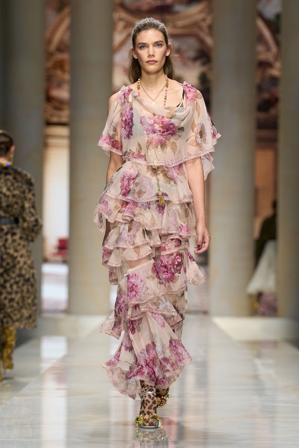 Dolce & Gabbana Spring 2027, look 16: peony-print sheer maxi dress with rows of lace-trimmed ruffles