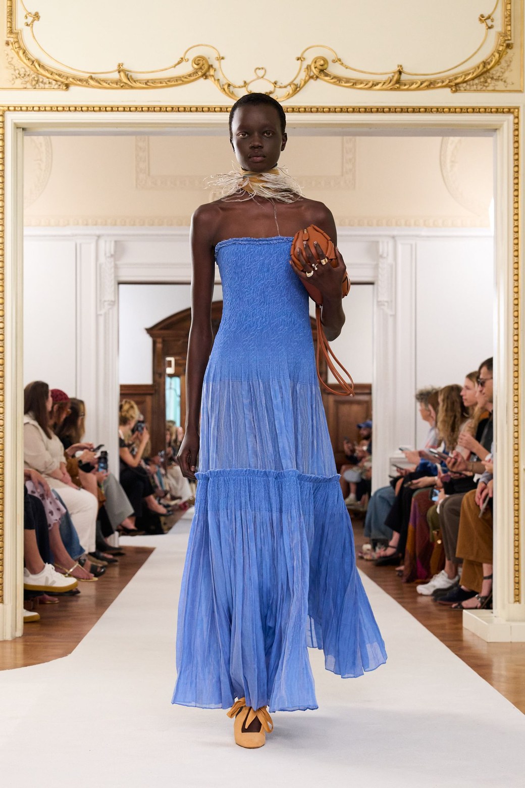 Ulla Johnson Spring 2026, look 8: blue strapless smocked maxi dress with a skirt of gathered tiers